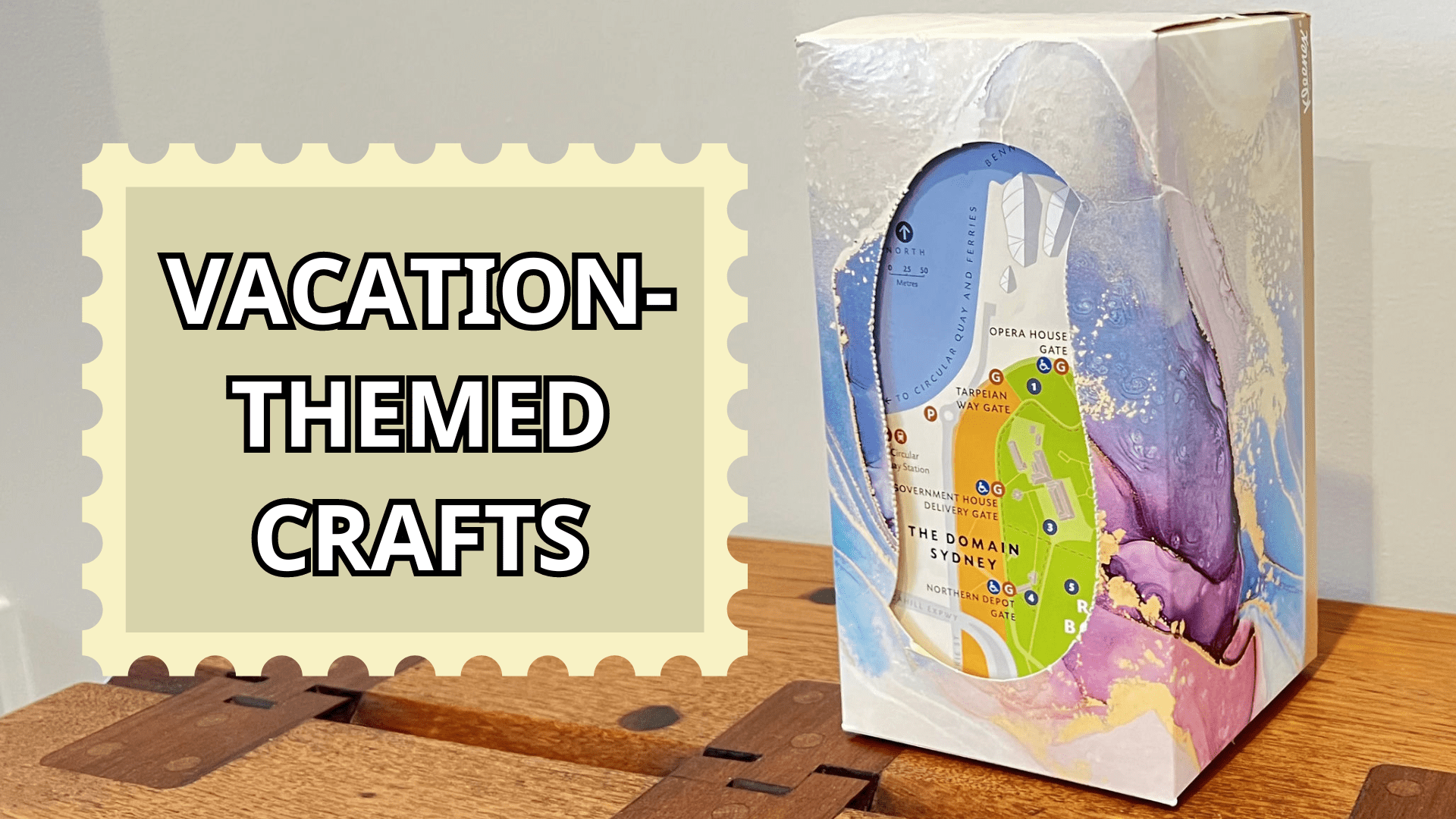 A map of Sydney, Australia / Gadigal Country inside a tissue box craft. The text "Vacation-Themed Crafts" inside a stamp. This introduces our vacation-themed crafts for kids.